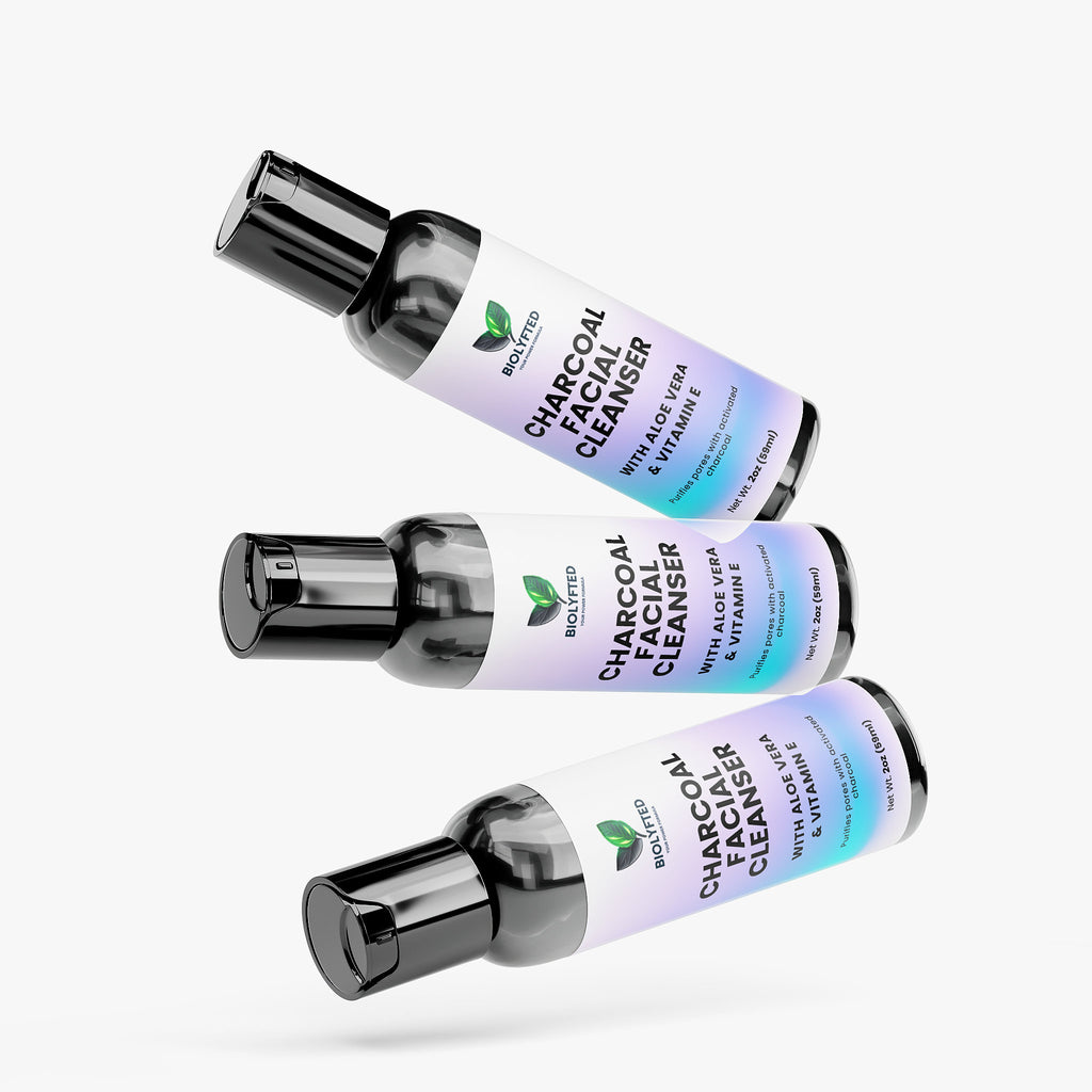 Three bottles of Charcoal Facial Cleanser on a white background